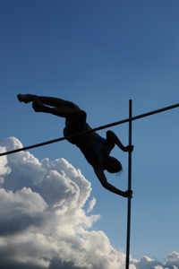 pole vaulter successfully clearing the bar